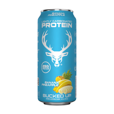 A can of Bucked Up Protein RTD with a blue background featuring a white deer logo, labeled as 'Banana Pineapple' flavor, and indicating 25g of protein, 0g sugar, and 0g fat.