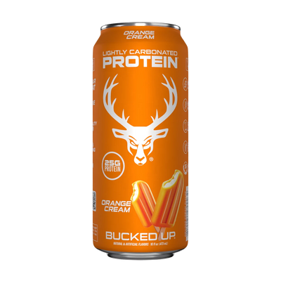 A can of Bucked Up Protein RTD Drink labeled as 'Orange Cream' flavor, and indicating 25g of protein, 0g sugar, and 0g fat.