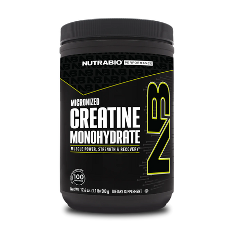 A container of NutraBio Creatine Monohydrate, which is a dietary supplement intended for muscle power and recovery. The container is black with green and yellow text, and it is labeled as micronized creatine monohydrate.