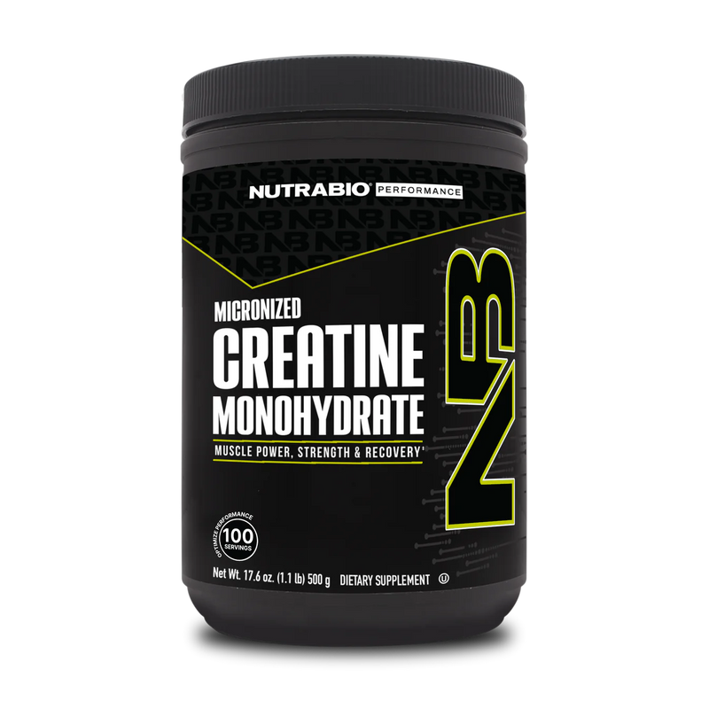 A container of NutraBio Creatine Monohydrate, which is a dietary supplement intended for muscle power and recovery. The container is black with green and yellow text, and it is labeled as micronized creatine monohydrate.