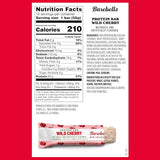 Nutrition facts label and Wild Cherry protein bar on a red background
