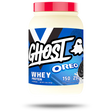 A container of GHOST Oreo Whey Protein powder, featuring the brand logo and the flavor Oreo prominently displayed on the label.